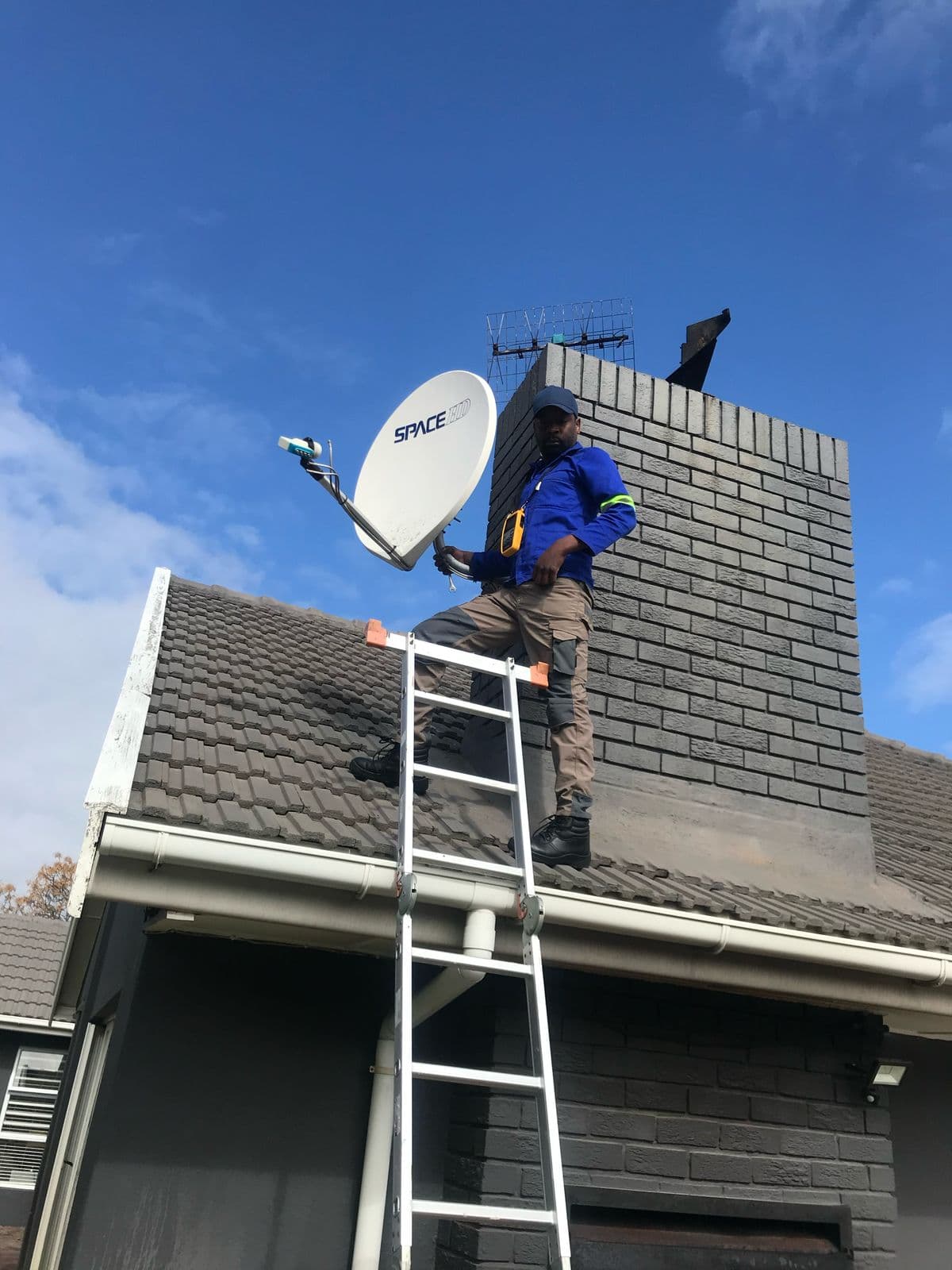 Accredited technician installing a DStv satellite dish in Cape Town